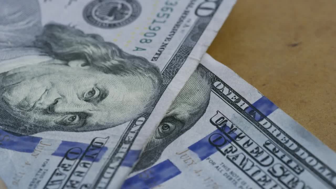 Stock Video 100 bills falling to the table PC Live Wallpaper