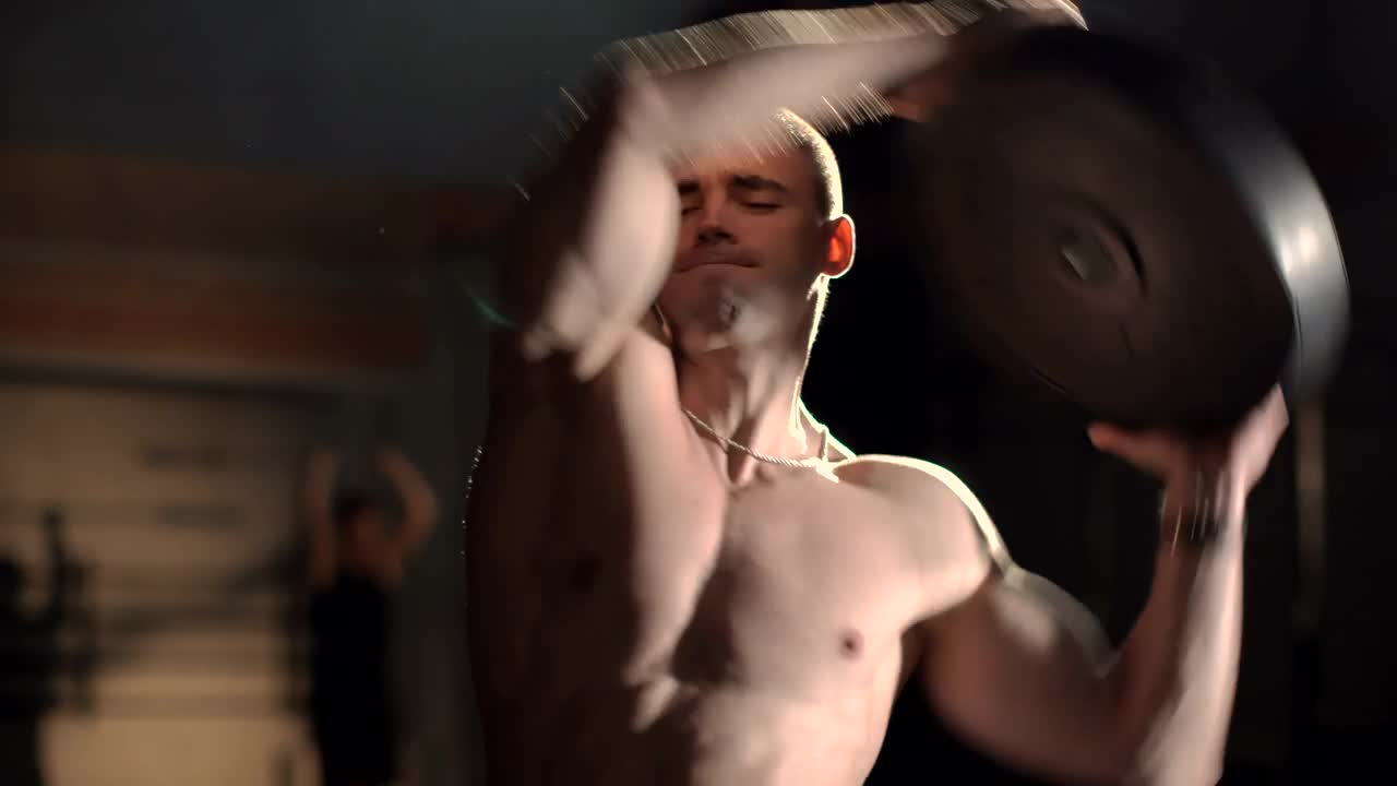 Stock Video A Bodybuilder Warms Up With The Weight Live Wallpaper for PC