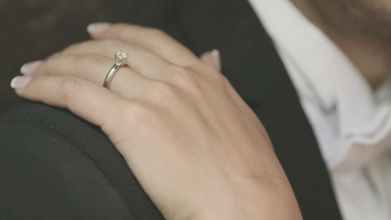 Stock Video A Brides Hand On The Grooms Shoulder At Their Wedding Live Wallpaper for PC