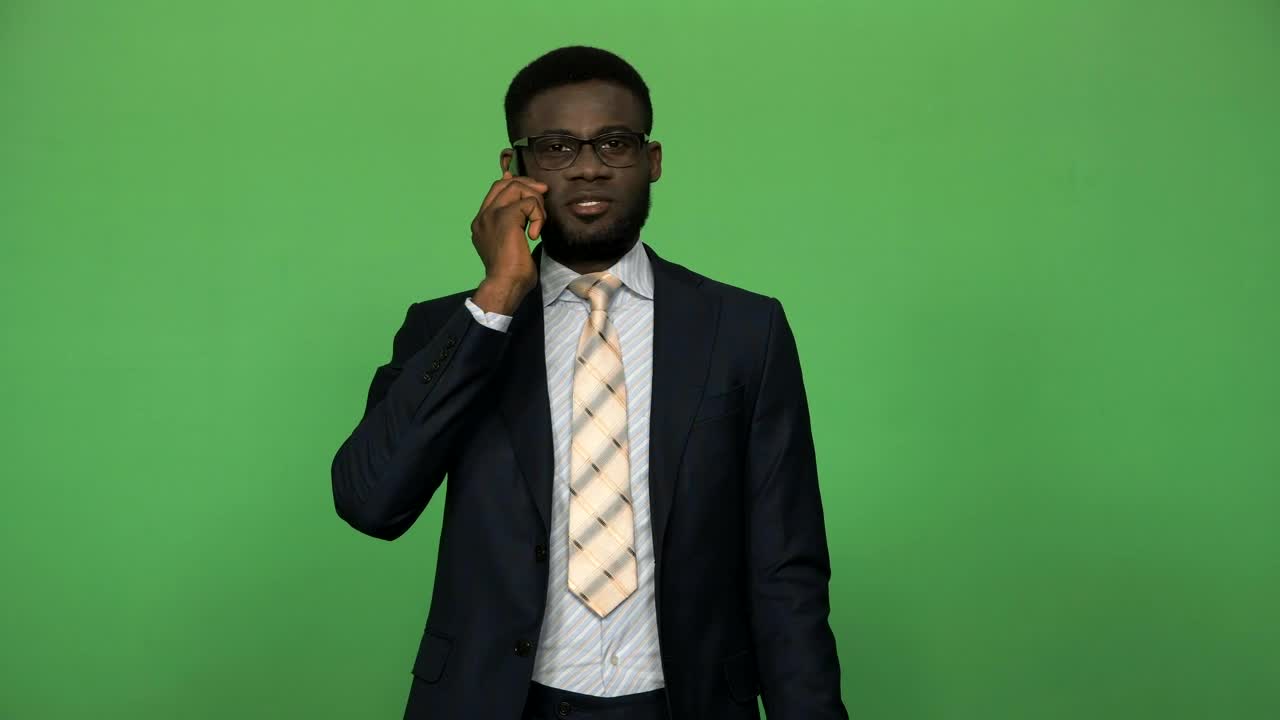 Stock Video A Businessman In A Suit Talking On The Phone Live Wallpaper for PC