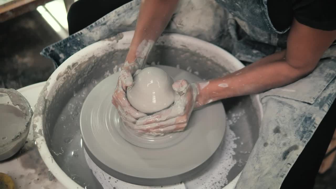Stock Video A Ceramic Artist Modeling Pottery Live Wallpaper for PC