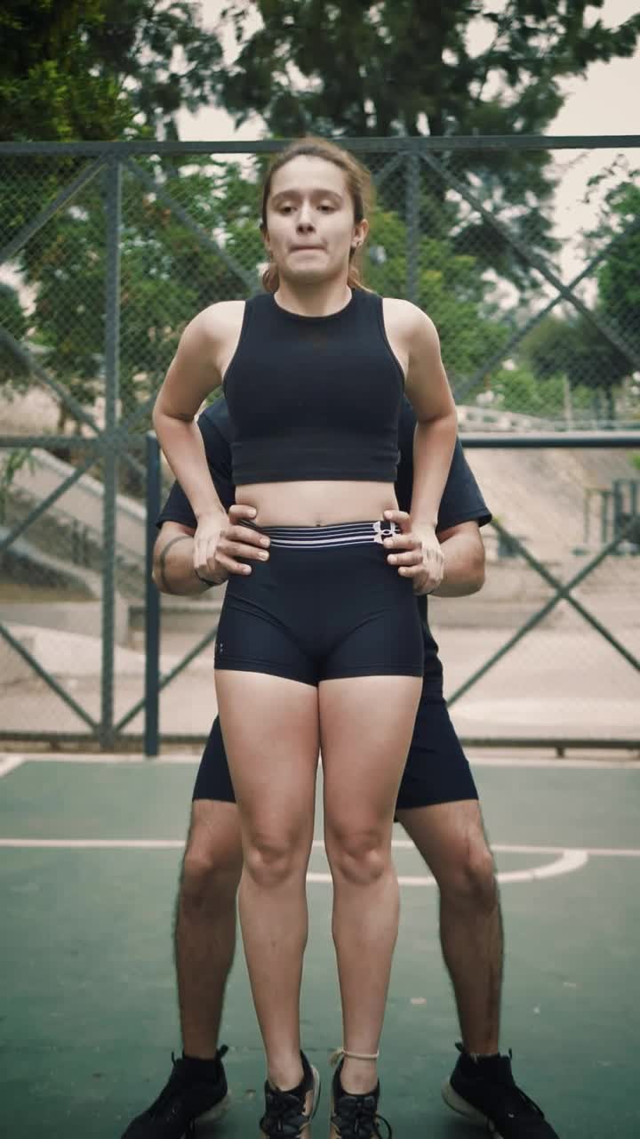 Stock Video A Cheerleader Boy Lifting And Carrying A Girl Up High Live Wallpaper for PC