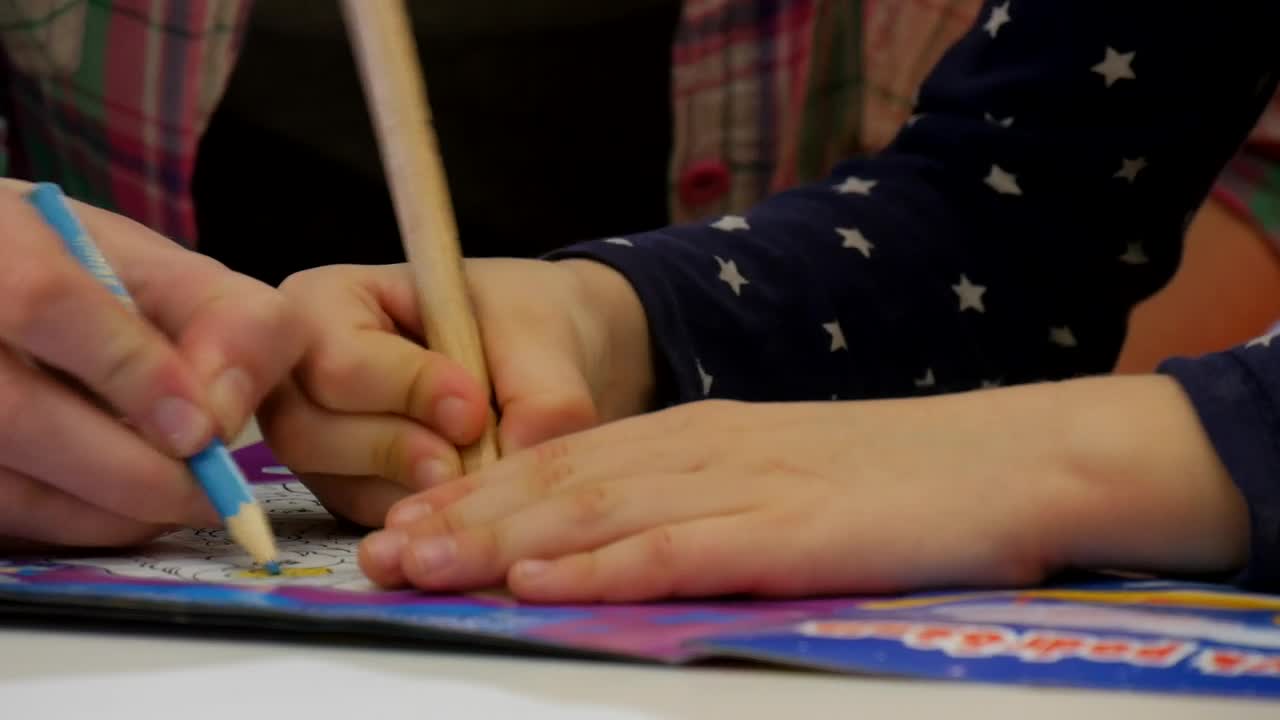 Stock Video A Child Using A Coloring Book Live Wallpaper for PC