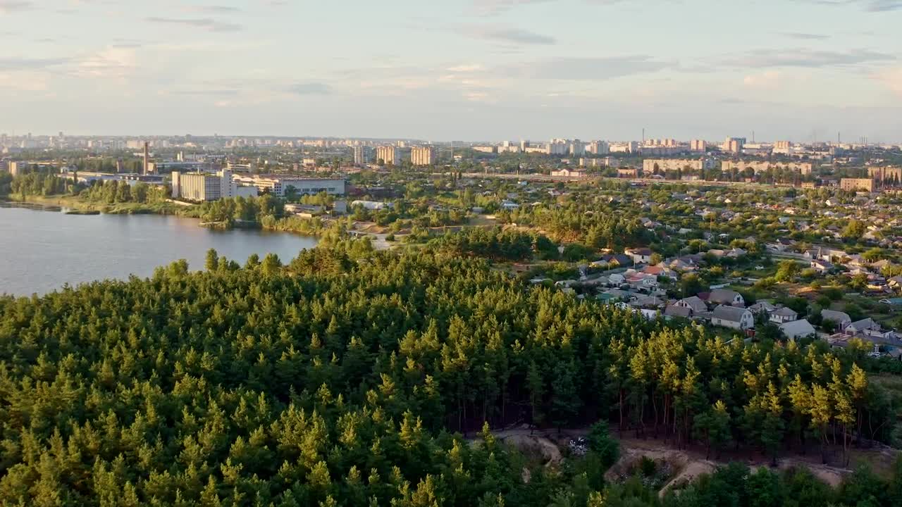 Stock Video A City By A Forest And A Lake Aerial Shot Live Wallpaper for PC