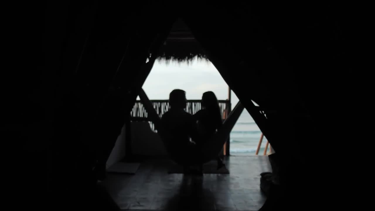 Stock Video A Couple In A Hammock At A Beach Hut Live Wallpaper for PC