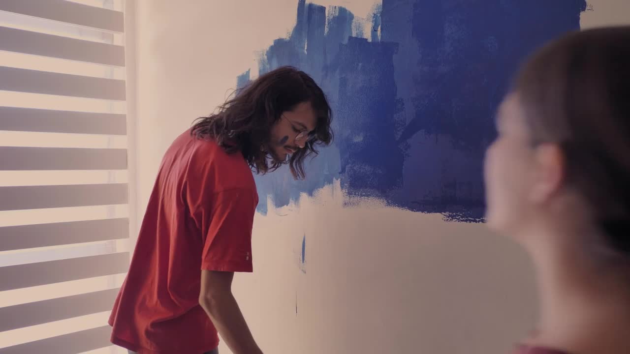 Stock Video A Couple In Love Painting A Wall Live Wallpaper for PC