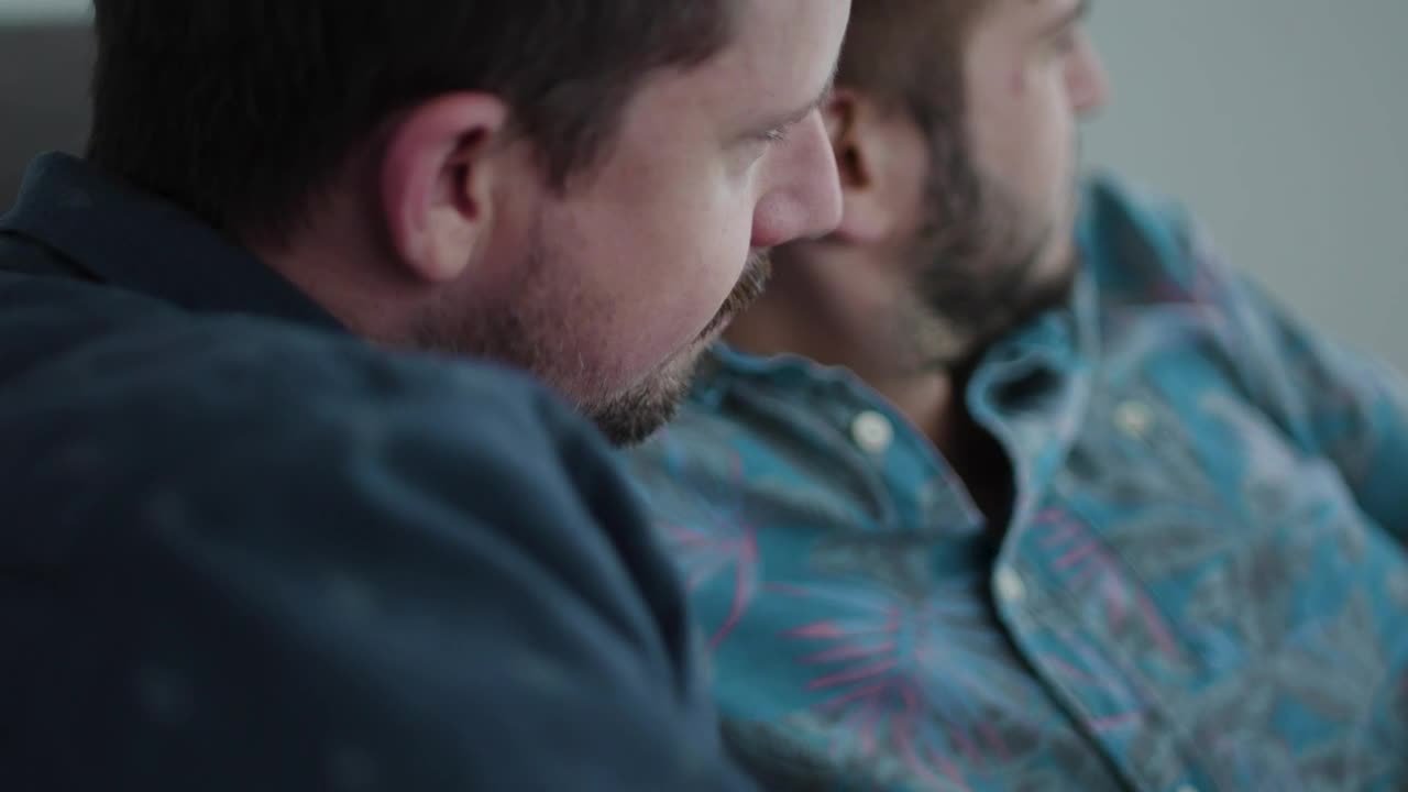 Stock Video A Couple Is Sitting Together On A Couch Live Wallpaper for PC