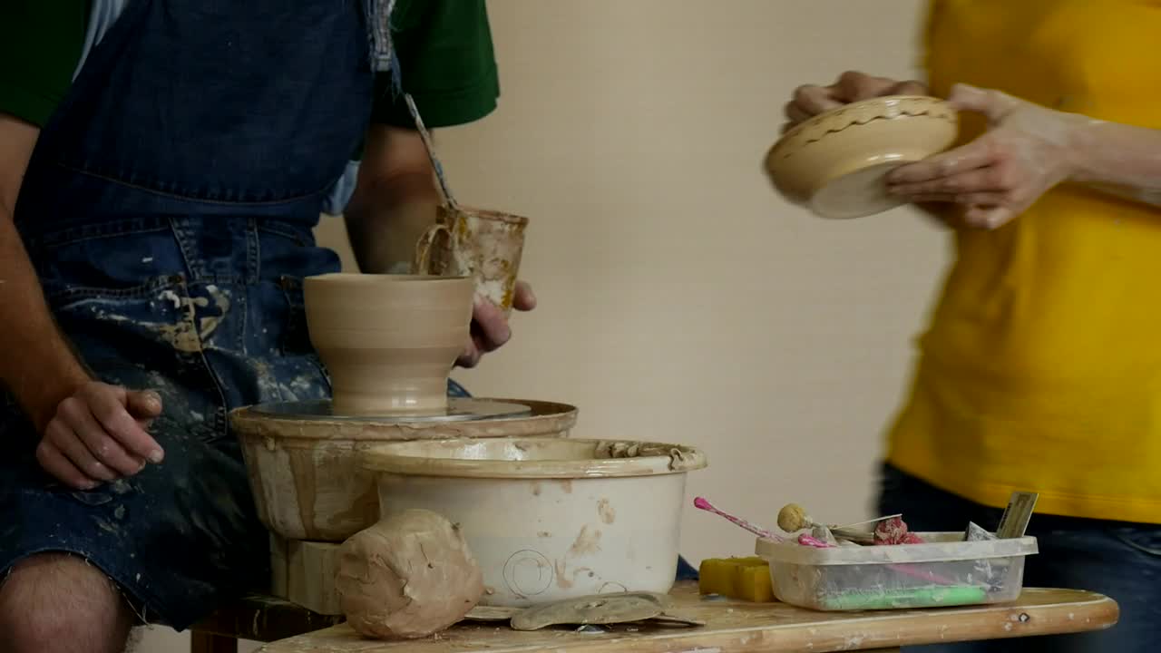 Stock Video A Couple Of Ceramic Artists Conversating Live Wallpaper for PC