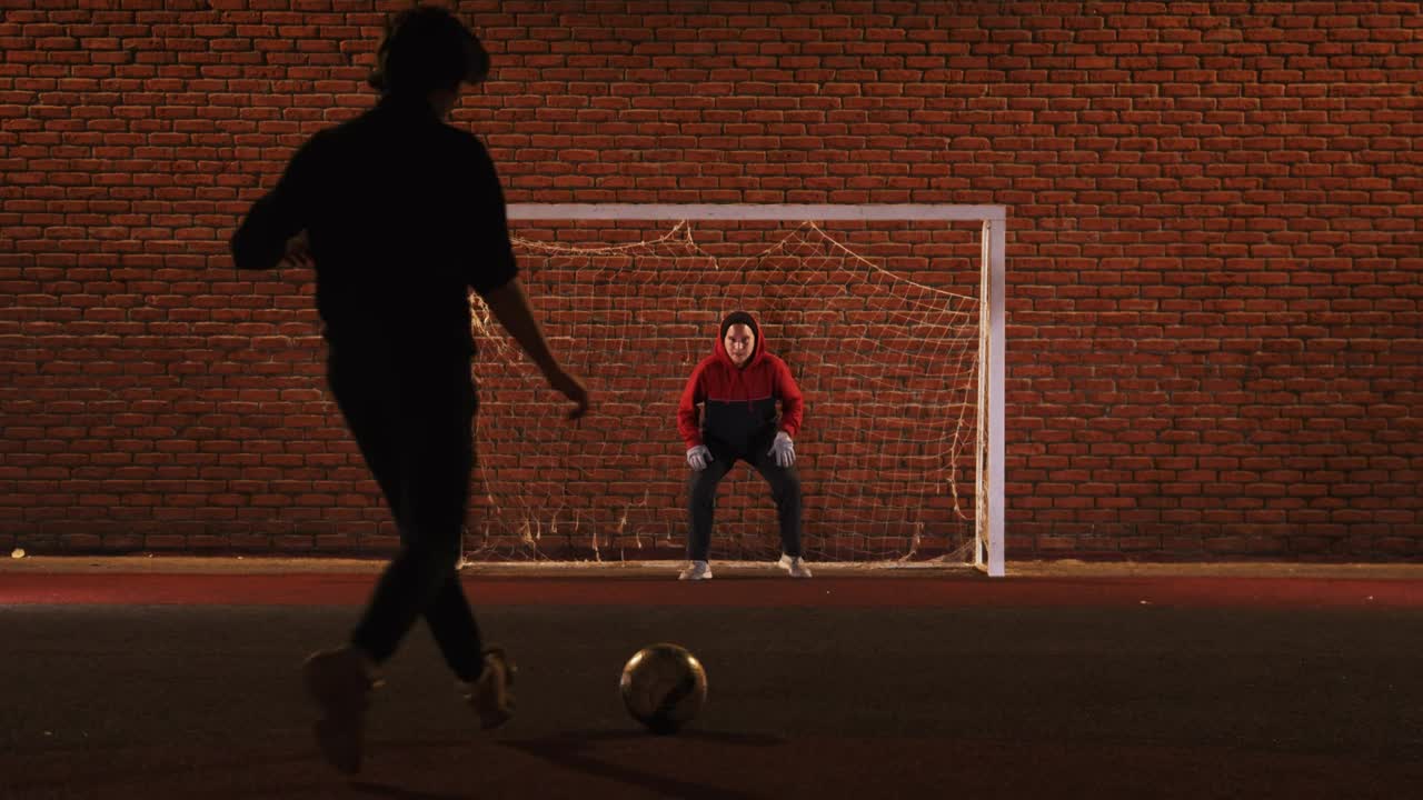 Stock Video A Couple Of Friends Playing Football At Night Live Wallpaper for PC