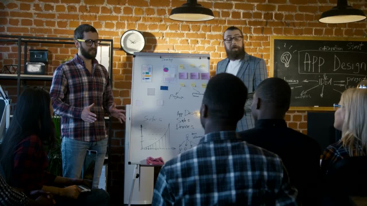 Stock Video A Couple Of Man Explaining App Software Design Live Wallpaper for PC