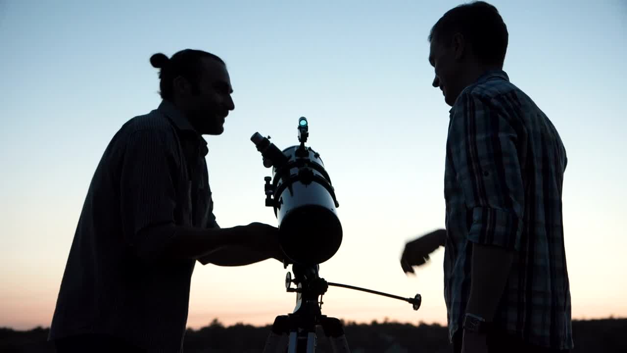 Stock Video A Couple Of Man Using A Telescope At Dawn Live Wallpaper for PC