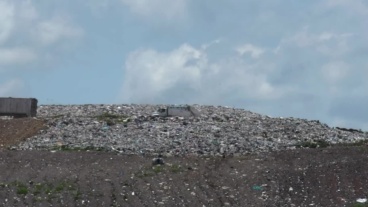 Stock Video A Couple Of Trucks Crossing A Hill In A Dump Live Wallpaper for PC