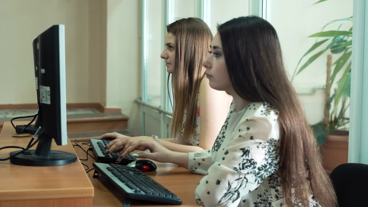 Stock Video A Couple Of Young Students In The Classroom Live Wallpaper for PC