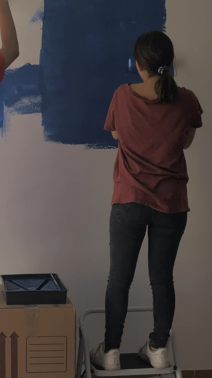 Stock Video A Couple Painting A Wall Blue Live Wallpaper for PC