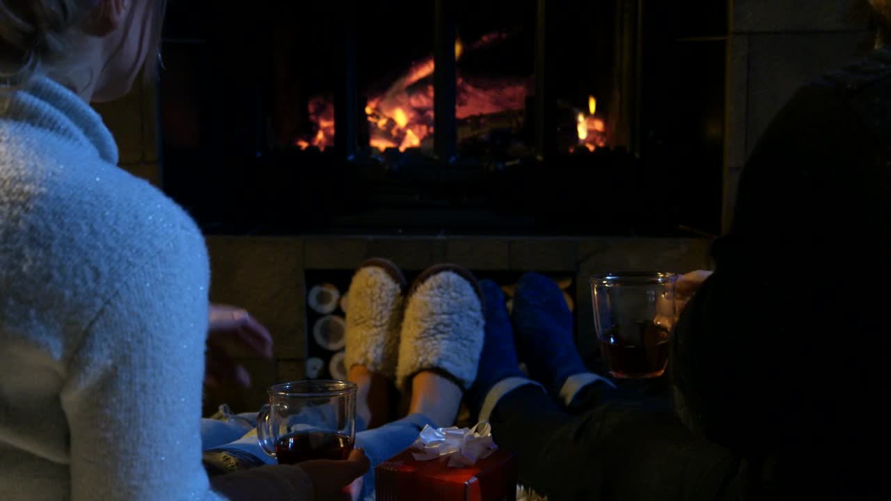 Stock Video A Couple Relaxing In Front Of A Chimney Live Wallpaper for PC