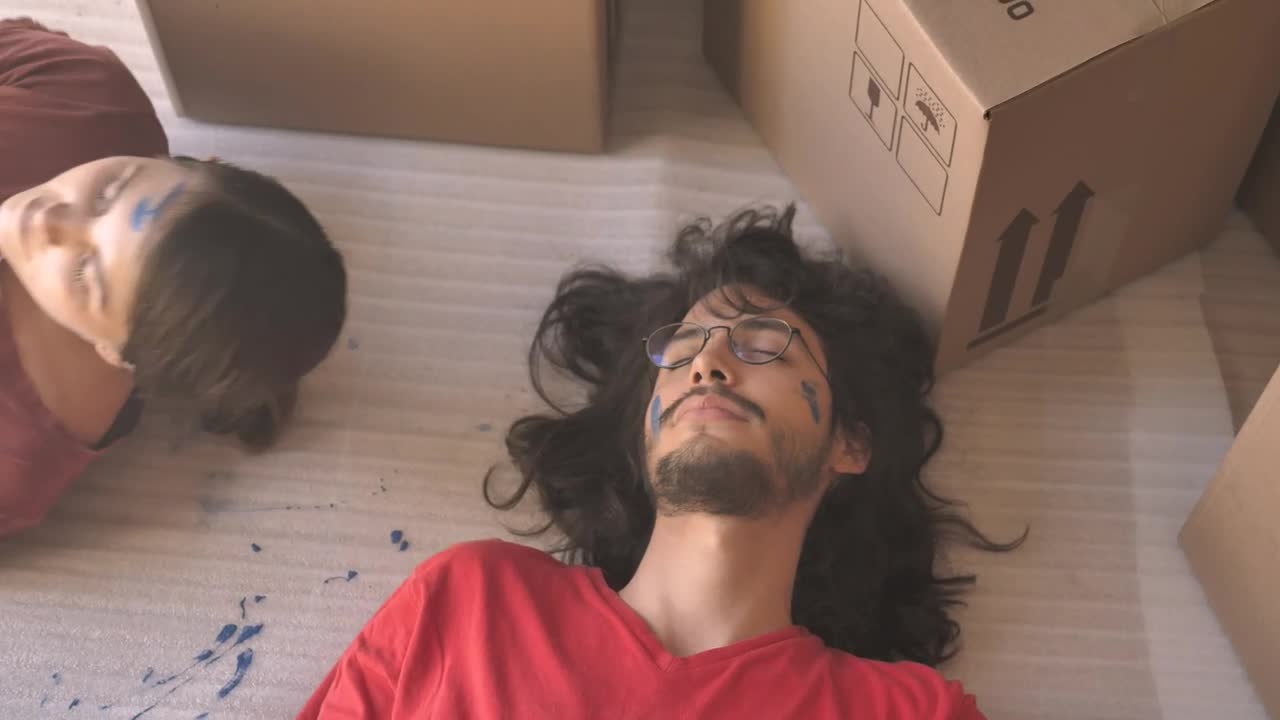 Stock Video A Couple Resting Lying In The Floor Live Wallpaper for PC