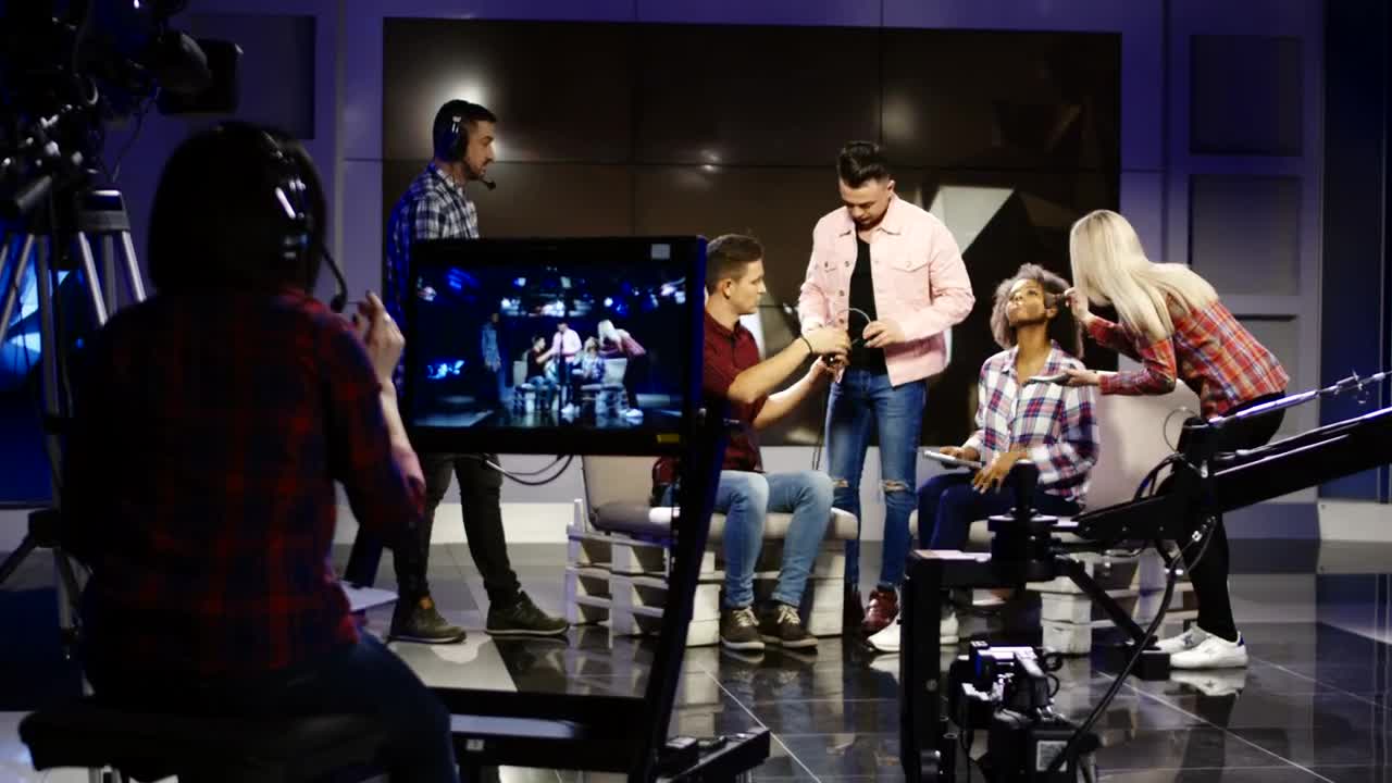 Stock Video A Crew In A Television Studio Getting People Ready Live Wallpaper for PC