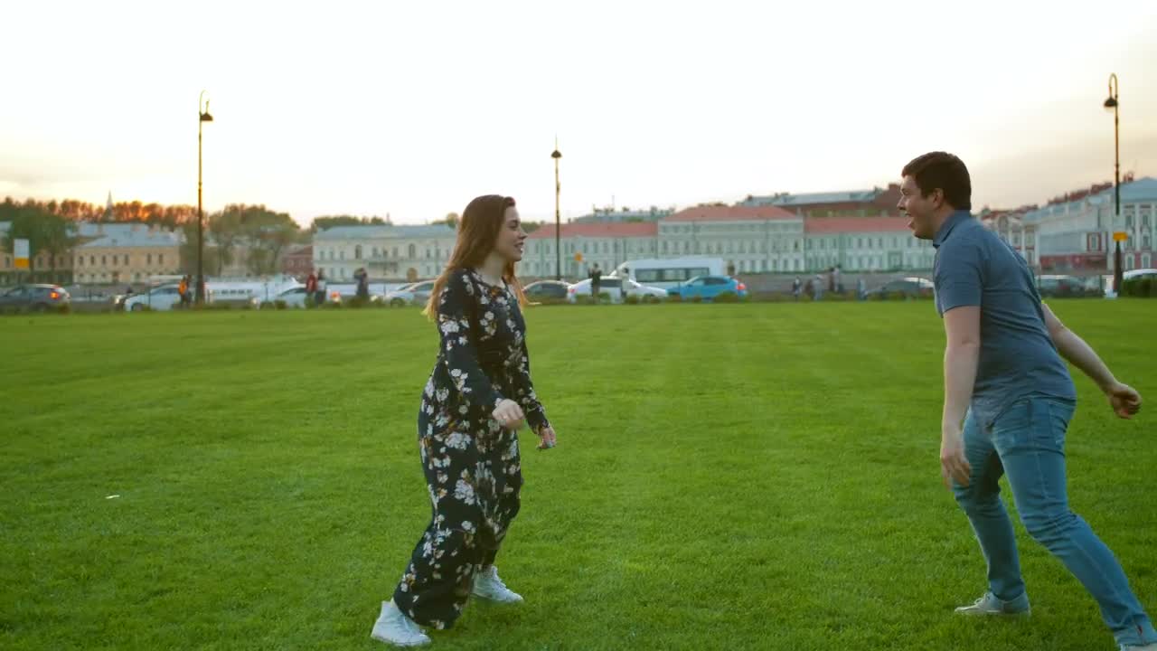 Stock Video A Cute Couple Playing On The Grass Live Wallpaper for PC