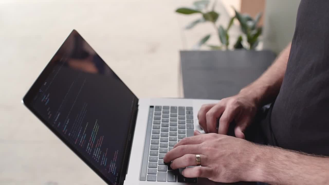 Stock Video A Developer Typing On A Laptop Top View Live Wallpaper for PC