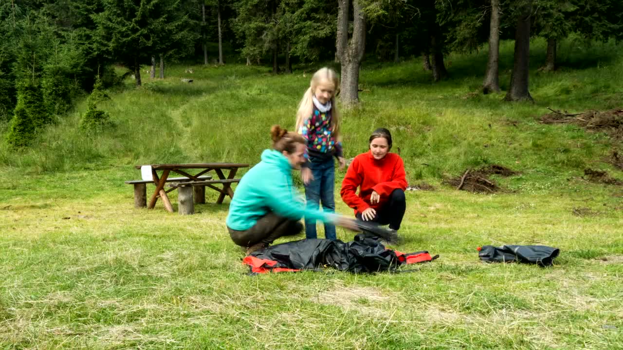 Stock Video A Family Setting Up A Camping Tent Live Wallpaper for PC