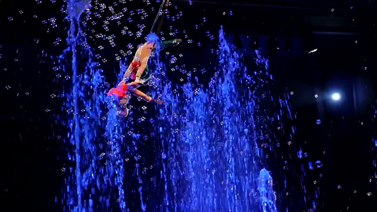 Stock Video Acrobats Performing Above Fountains Live Wallpaper for PC
