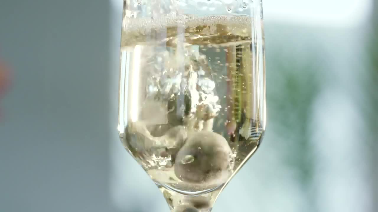 Stock Video Adding Blueberries To A Champagne Glass Live Wallpaper for PC