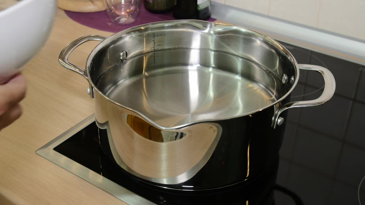 Stock Video Adding Cut Mushrooms To A Pan Live Wallpaper for PC