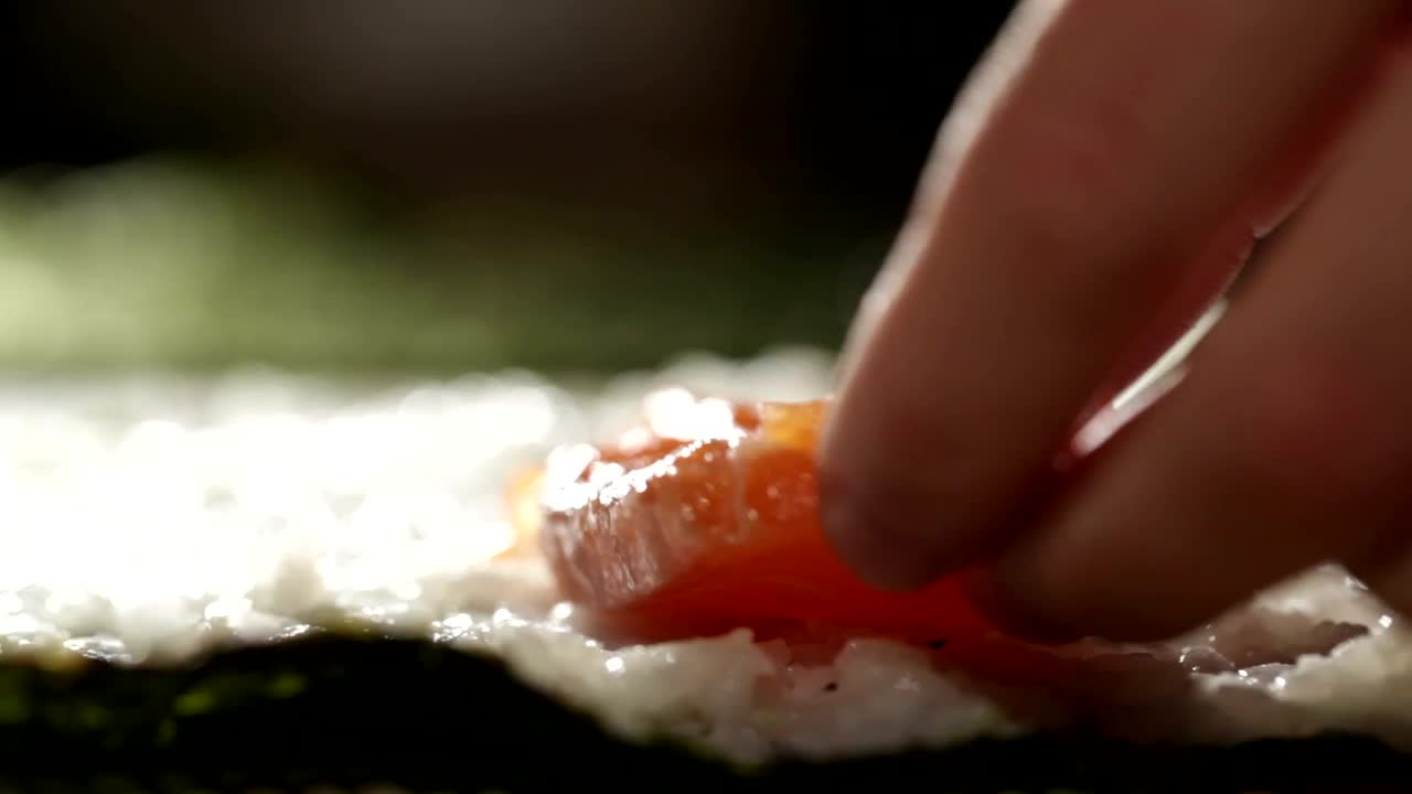 Stock Video Adding Fish And Cheese To A Sushi Roll Live Wallpaper for PC