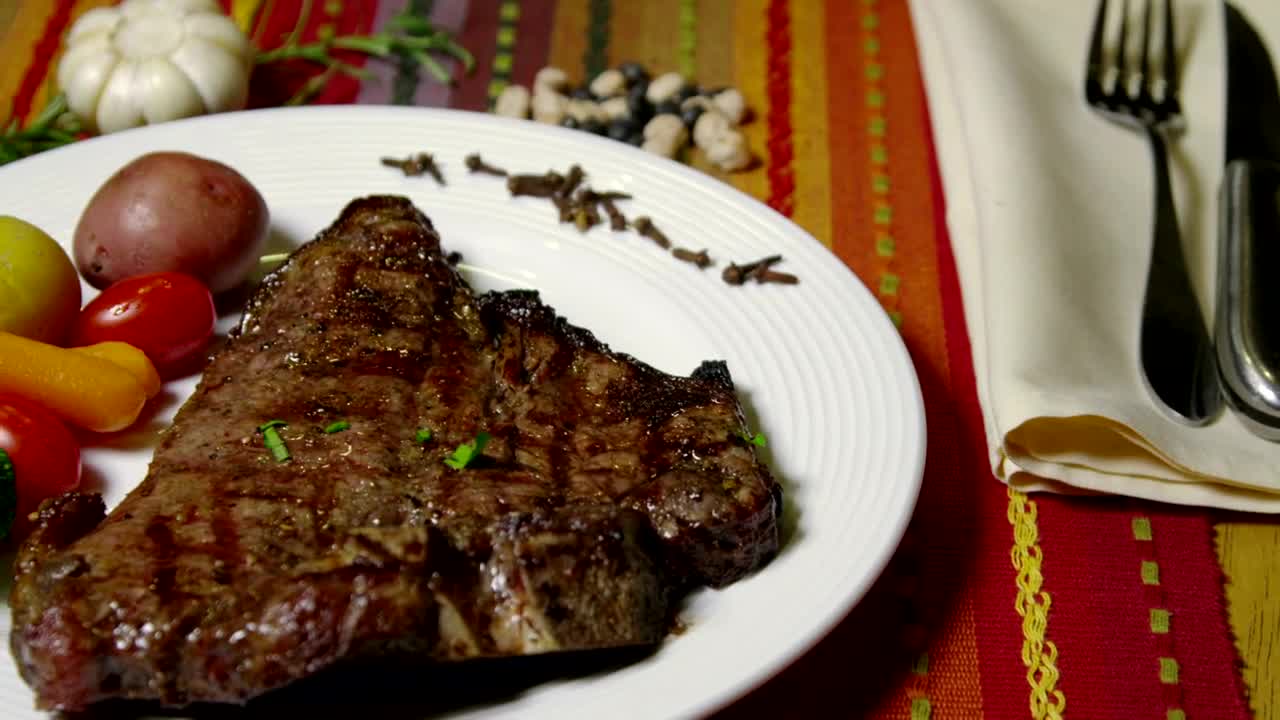 Stock Video Adding Fresh Herbs To A Steak Live Wallpaper for PC