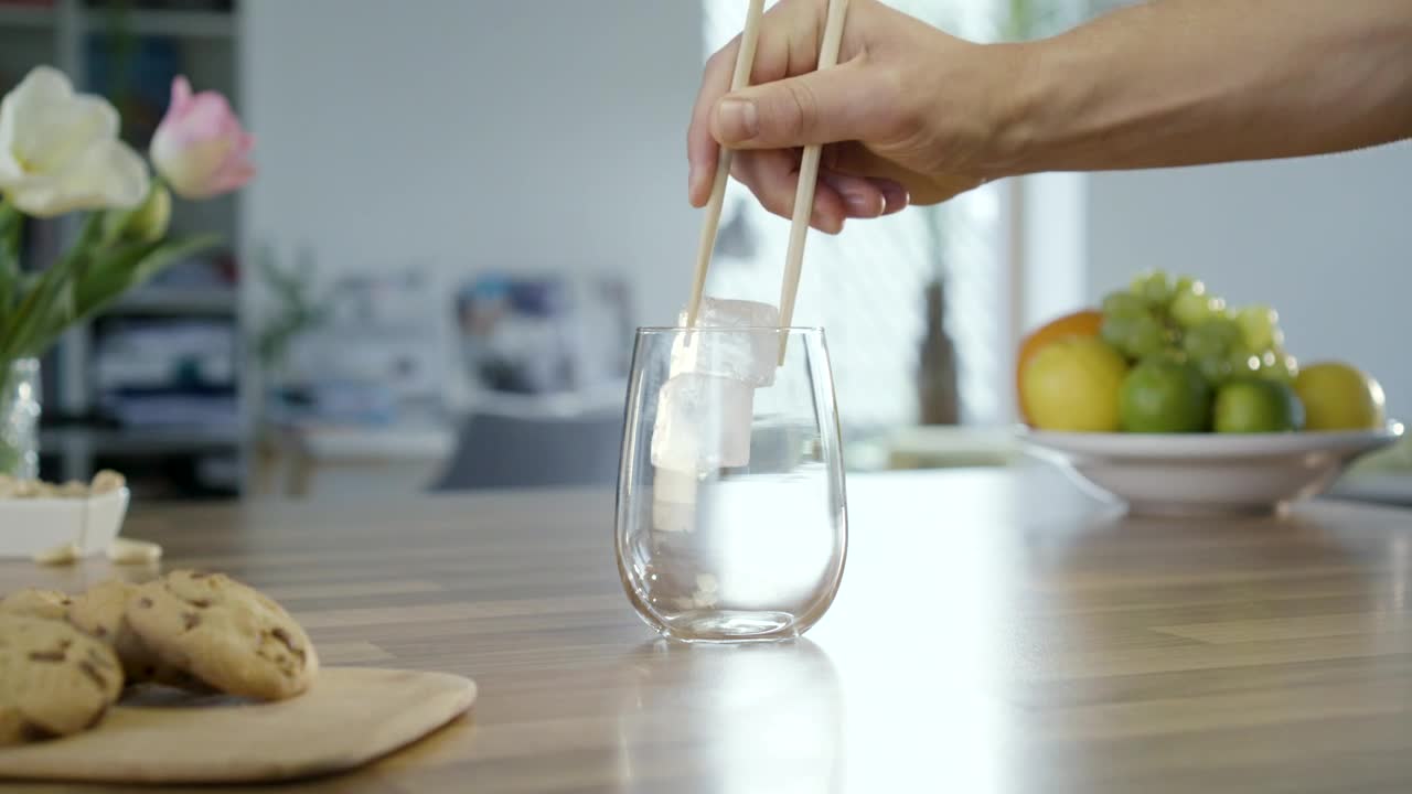 Stock Video Adding Ice To A Glass With Chopsticks Live Wallpaper for PC