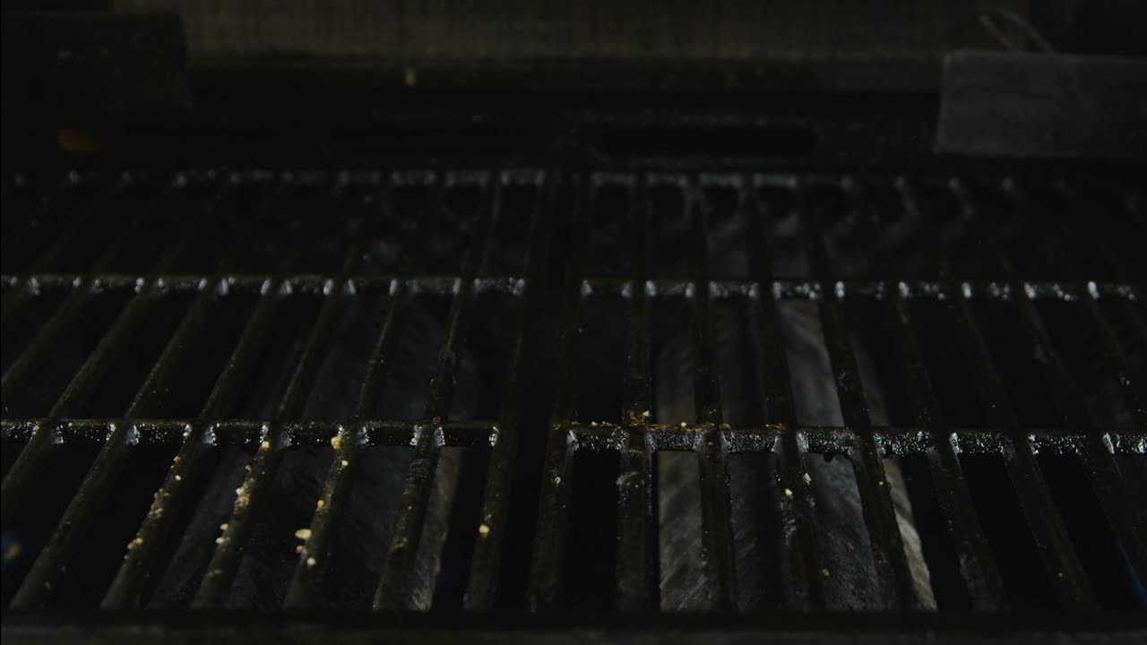 Stock Video Adding Seasoned Steaks To A Grill Live Wallpaper for PC