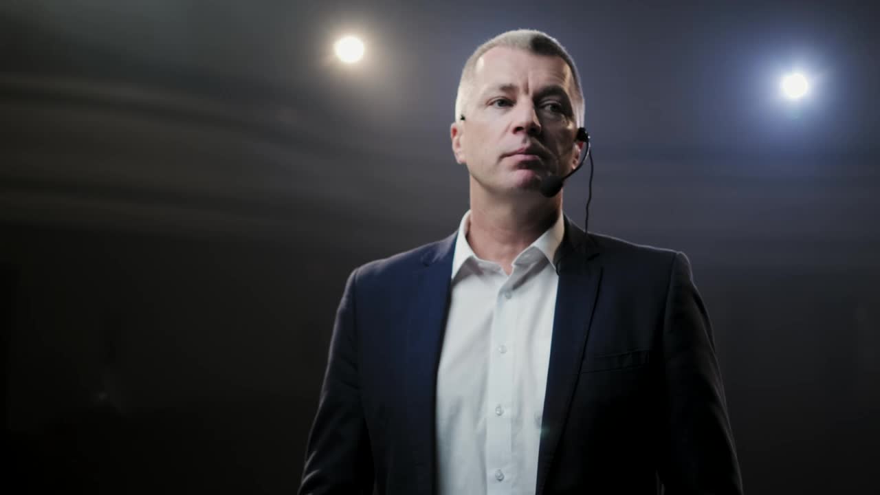 Stock Video Adult Man With Headset Microphone On Stage Live Wallpaper for PC