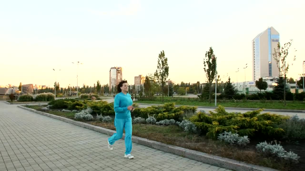 Stock Video Adult Woman Jogging Through A Large Garden  Larg Live Wallpaper for PC