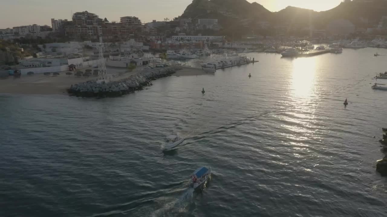 Stock Video Aerial Shot Of A Boat Moving Away From A Coast Live Wallpaper for PC