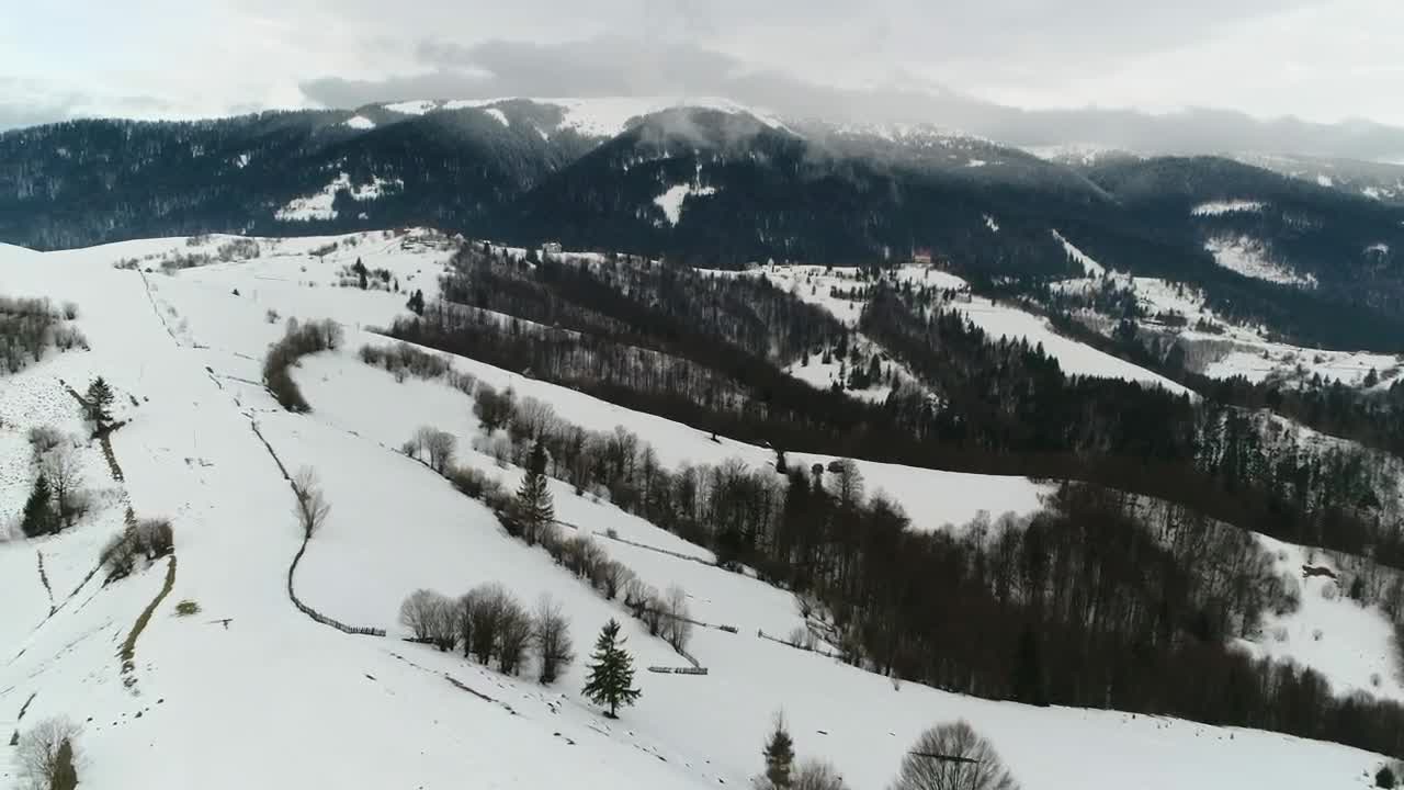 Stock Video Aerial Shot Over Foggy Frozen Mountains Live Wallpaper for PC
