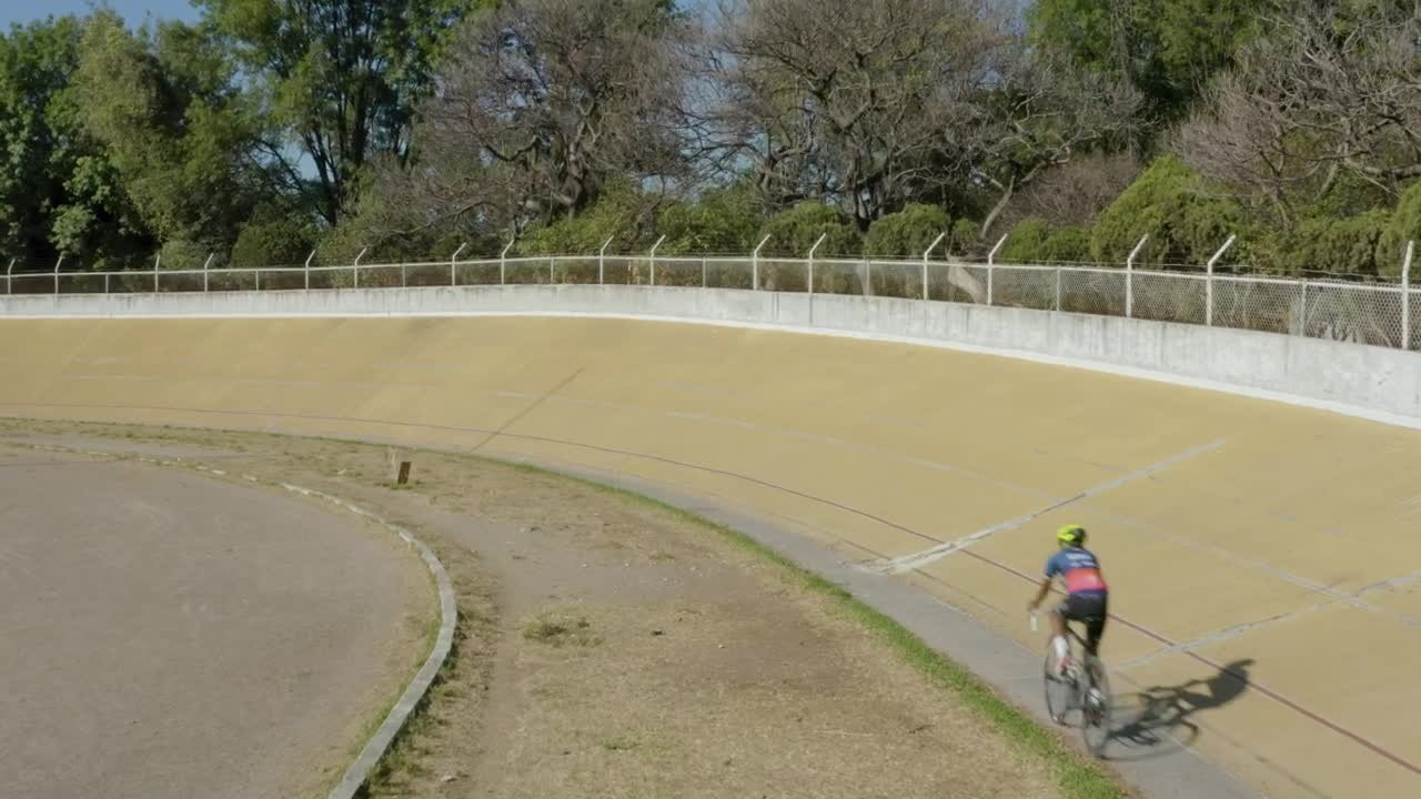 Stock Video Aerial Video Tracking A Cyclist On A Track Live Wallpaper for PC