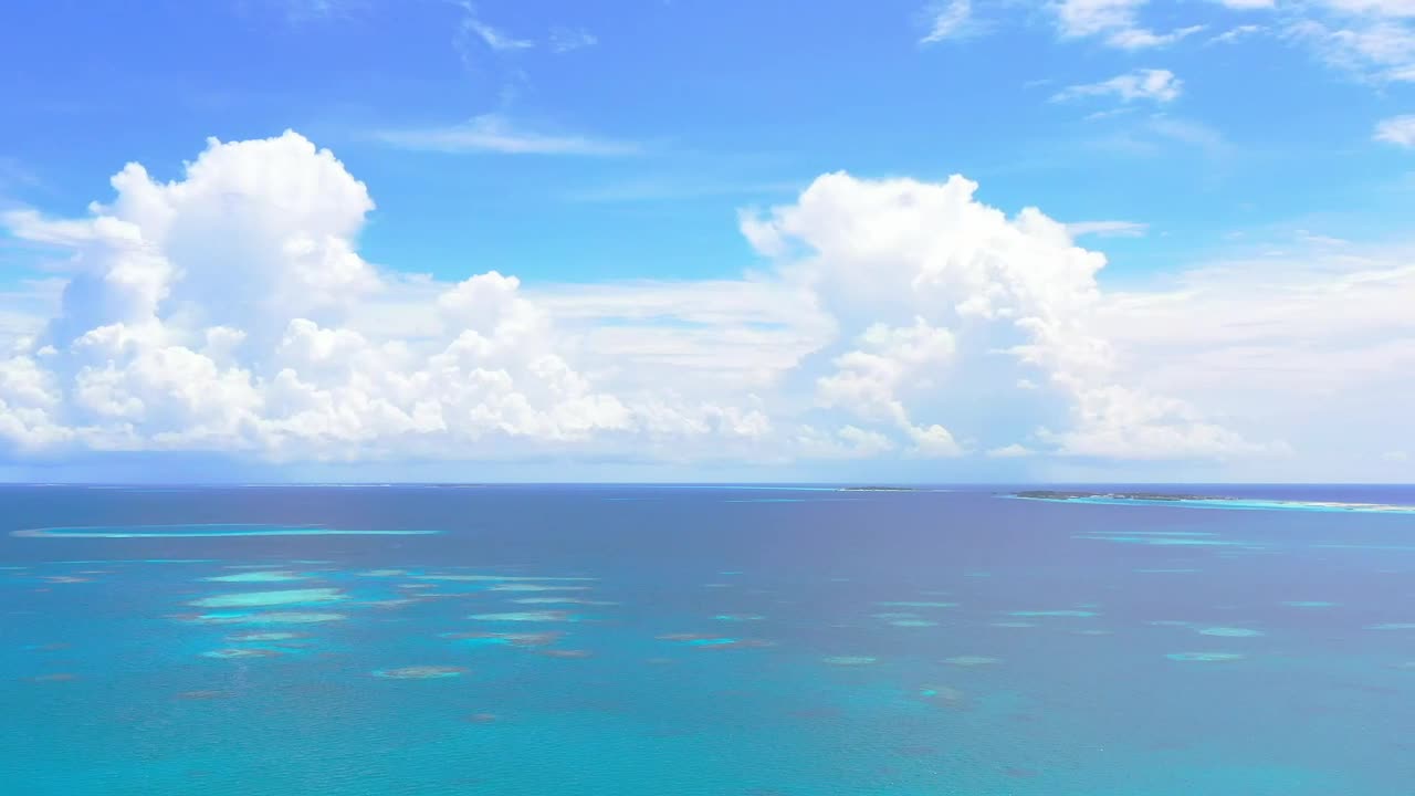Stock Video Aerial View Of A Blue Sea With Big Clouds Live Wallpaper for PC