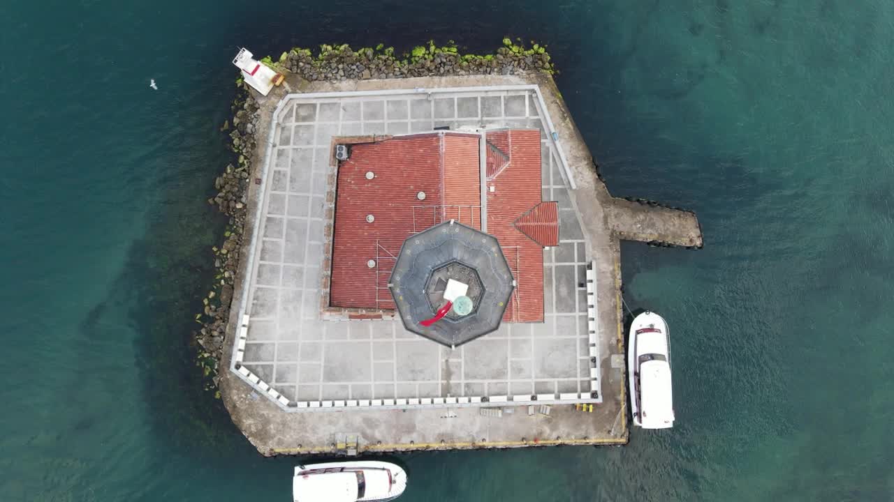 Stock Video Aerial View Of A Lighthouse On A Small Island Live Wallpaper for PC