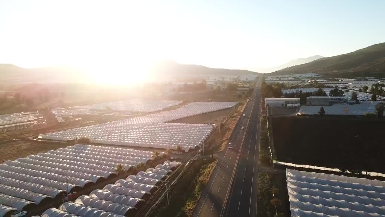 Stock Video Aerial View Of A Road Between Greenhouses Live Wallpaper for PC