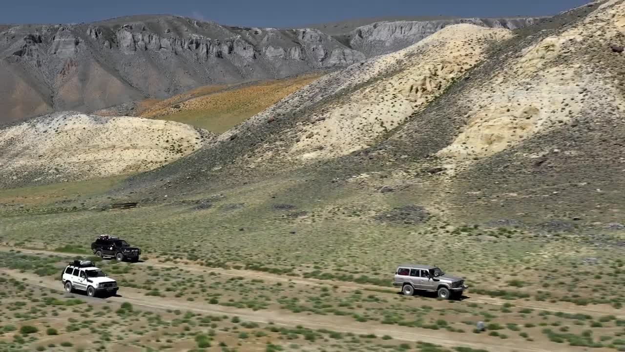 Stock Video Aerial View Of A Safari Trip With Off Road Trucks Live Wallpaper for PC