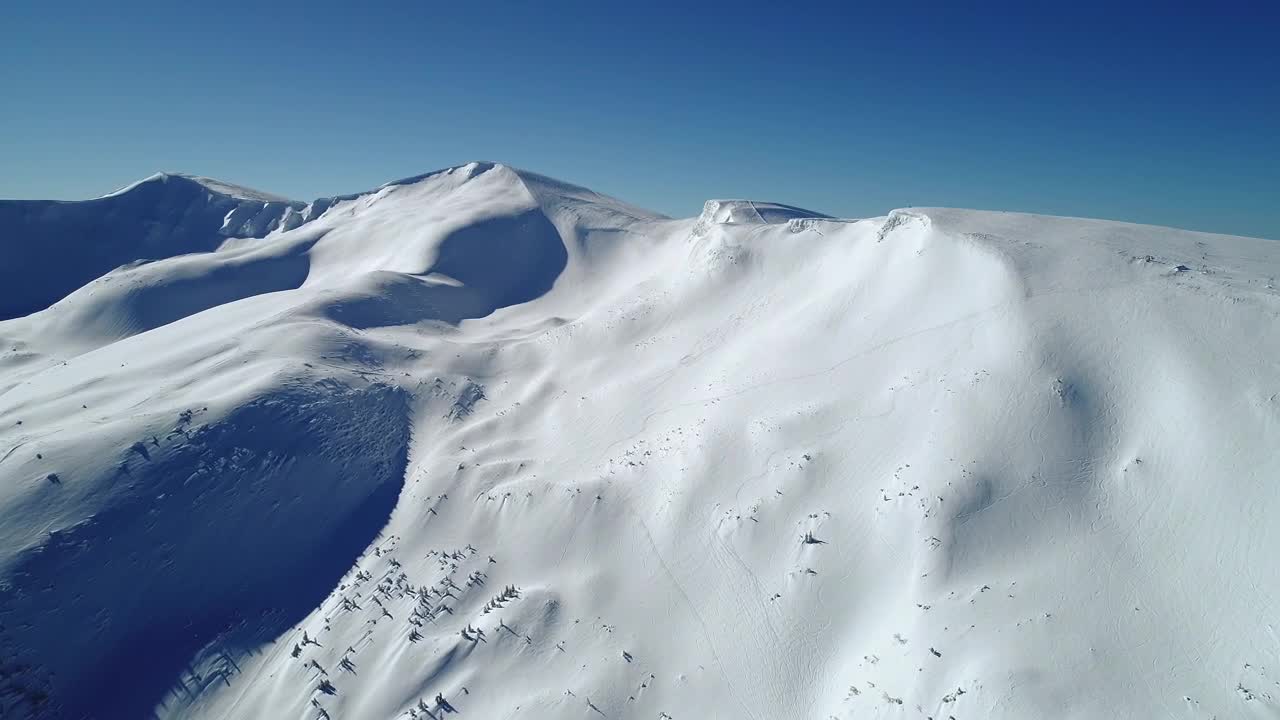 Stock Video Aerial View Of A Snow Covered Mountain Landscape Live Wallpaper for PC