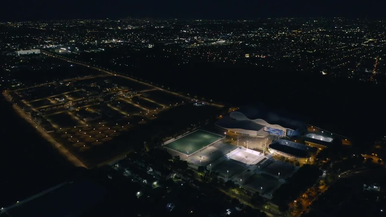 Stock Video Aerial View Of A Sports Center At Night Time Live Wallpaper for PC