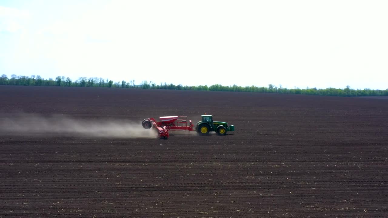 Stock Video Aerial View Of A Tractor Working On The Dirt Field Live Wallpaper for PC