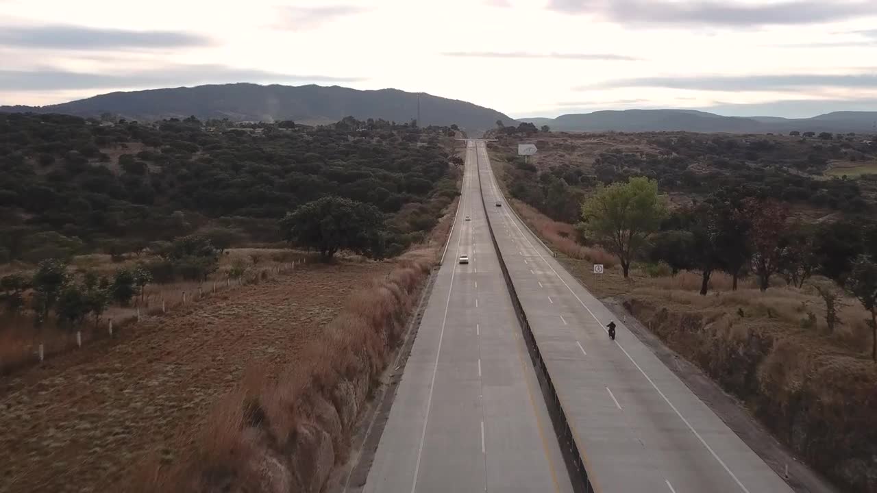Stock Video Aerial View Of Biker Riding A Motorcycle Live Wallpaper for PC
