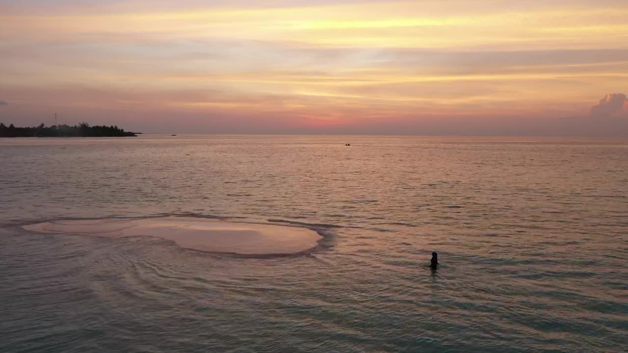 Stock Video Aerial View Of Beach With A Woman Walking At Sunset Live Wallpaper for PC
