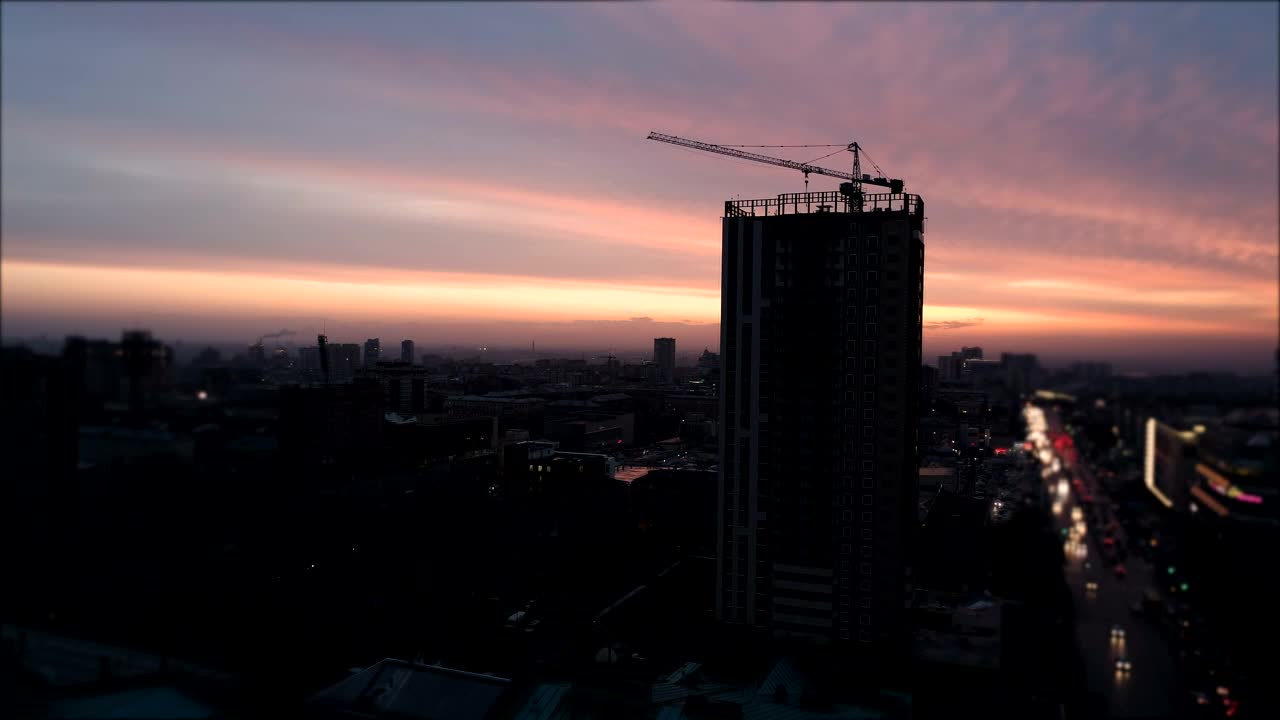 Stock Video Aerial View Of City Construction Crane At Sunset Live Wallpaper for PC