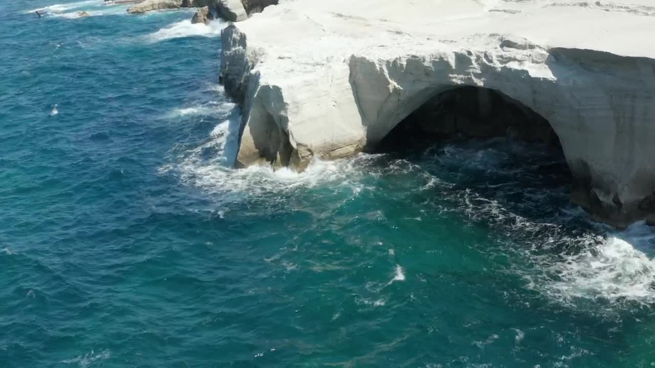 Stock Video Aerial View Of Sarakiniko Lunar Volcanic Beach Live Wallpaper for PC