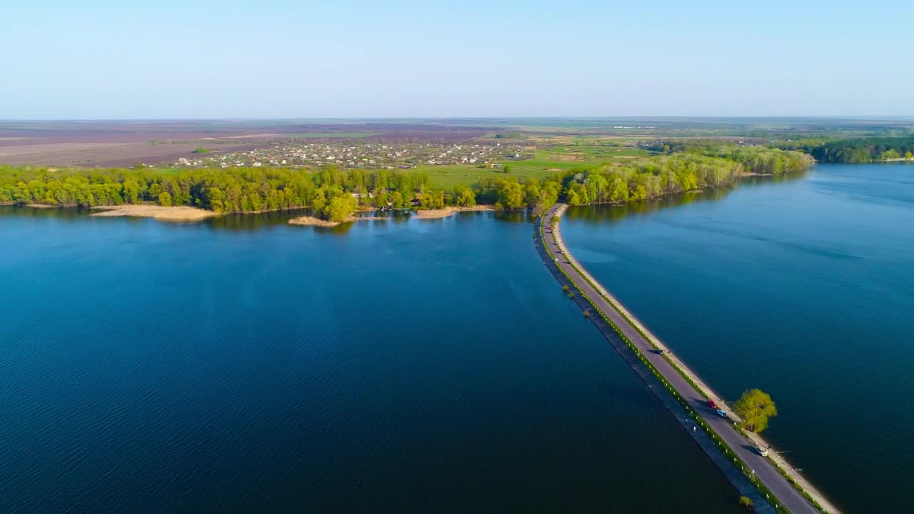 Stock Video Aerial View Of The Dam River With A Road Crossing Live Wallpaper for PC
