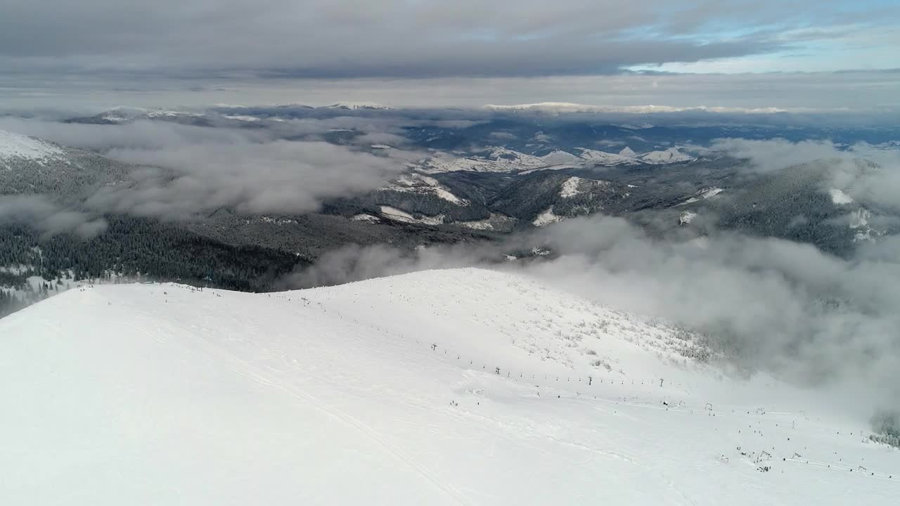 Stock Video Afar Aerial Shot Of A Ski Station In A Mountain Live Wallpaper for PC