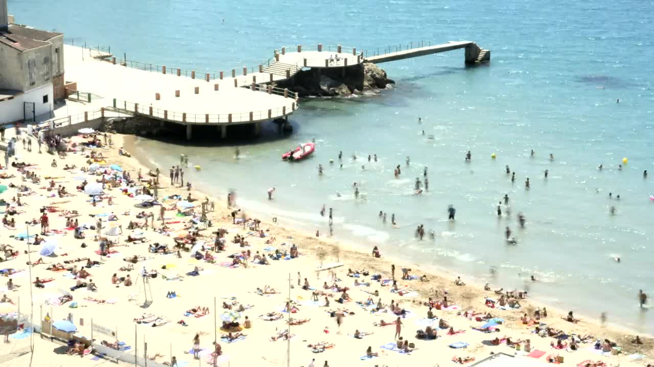 Stock Video Beach Full Of Tourists Next To The Pier Live Wallpaper For PC